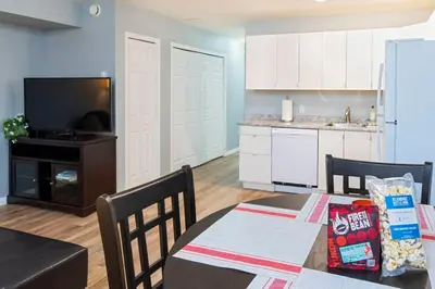 a kitchen and a dining room with a table and chairs at NN - The Mack - Crestview 1-bed 1-bath in Whitehorse