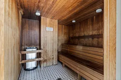a sauna with wood paneled walls at Near BC Place & SkyTrain Access & Free Parking in Vancouver