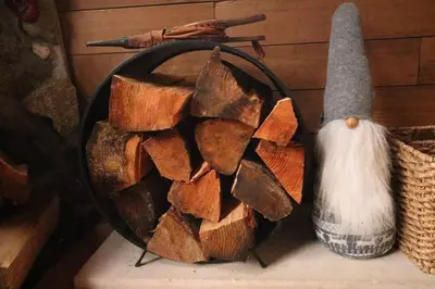 a bowl of fire wood and a mortar and pestle at Romantic Off-Grid Cabin by Glacier lake in Pemberton