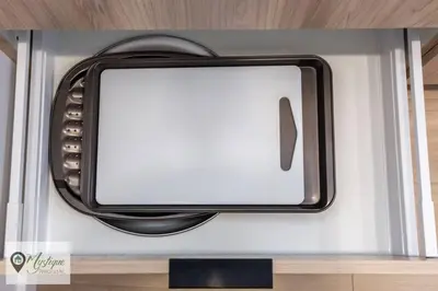 a television with a white screen on a shelf at Modern Suite King Bed Near Whyte Ave and U of A WIFI in Edmonton