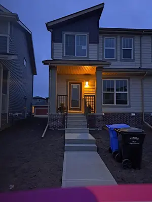 a house with a pathway leading to the front door at PeaceHouse for females only - Business visits in Calgary