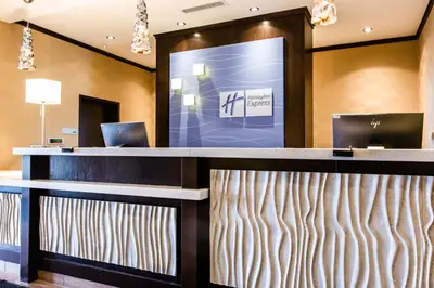 a lobby of a hotel with a reception desk at Holiday Inn Express & Suites Spruce Grove - Stony Plain by IHG in Spruce Grove