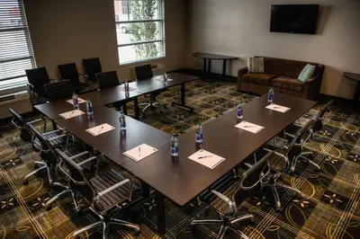 a large conference room with tables and chairs at Holiday Inn Express & Suites Spruce Grove - Stony Plain by IHG in Spruce Grove