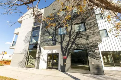 a building with the front entrance of a building at Modern Country Retreat-5 min to DTN-U/G Parking in Edmonton