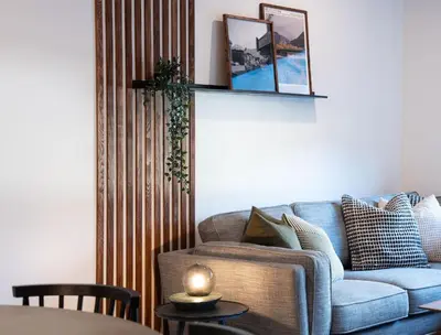 a living room with a couch and a table at Villa 23 Cabot Peaks by Revelstoke Vacations in Revelstoke