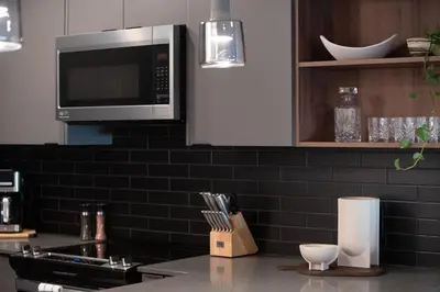 a kitchen with a microwave and a counter top at Villa 23 Cabot Peaks by Revelstoke Vacations in Revelstoke