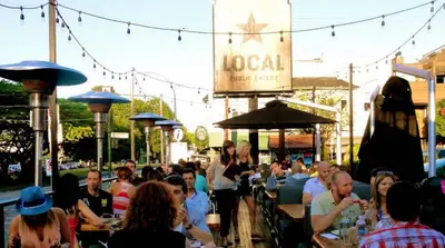 a group of people sitting at tables at a restaurant at Small Private Studio at Kitsilano Beach in Vancouver