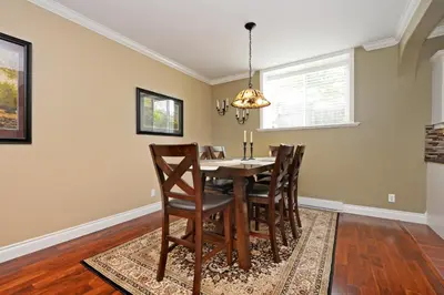 a dining room with a table and chairs at Upscale Character Home with Luxurious Amenities in Victoria