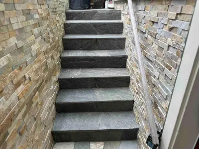 a stairway leading up to a brick wall at Upscale Character Home with Luxurious Amenities in Victoria