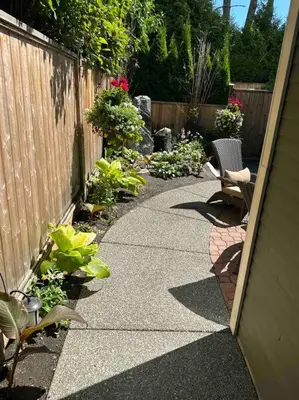 a walk way with two chairs and a fence at Upscale Character Home with Luxurious Amenities in Victoria