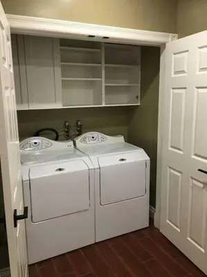 a laundry room with two washers and a sink at Upscale Character Home with Luxurious Amenities in Victoria