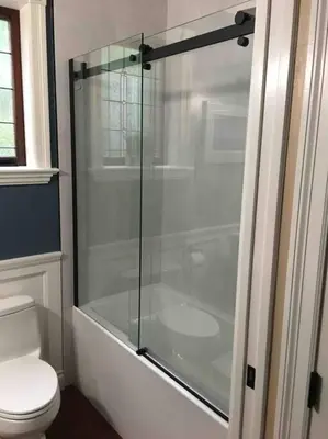 a glass shower in a bathroom with a toilet at Character Stay across Swan Lake Nature Sanctuary in Victoria