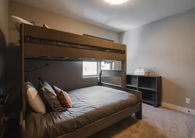a bedroom with a bunk bed in a room at Echo Landing #20 townhouse in Sun Peaks