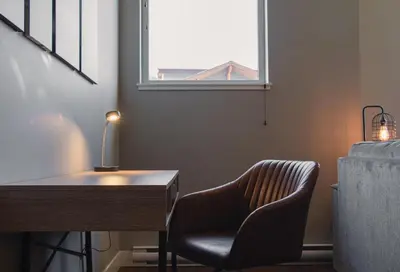 a desk and a chair in a room with a window at Echo Landing #20 townhouse in Sun Peaks