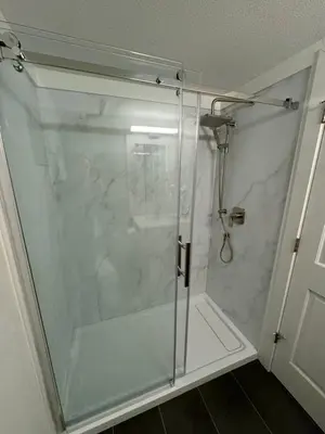 a shower with a glass door in a bathroom at Beautiful 1BR 1BA Apartment at NORTHSTAR-Whistler, BC in Whistler
