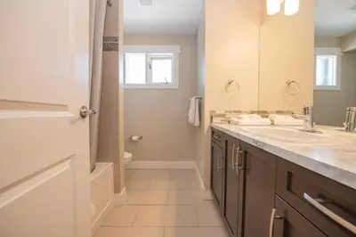 a bathroom with a sink and a toilet at Lakeviews, big yard/deck, minutes to Silver Star/Golf/Wineries. in Vernon