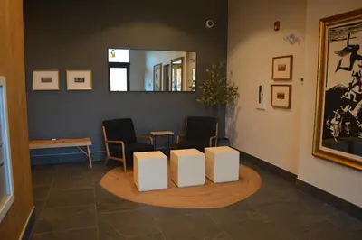 a waiting room with two chairs and a mirror at Stokeside Serenity in Revelstoke