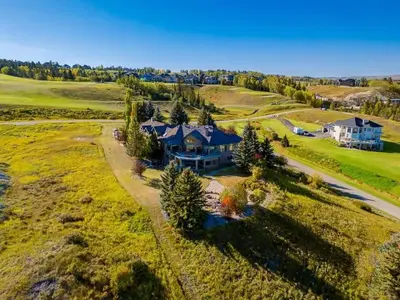 an aerial view of a large house on a field at Emerald Bay Luxury Retreat with Hot Tub in Calgary