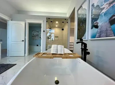 a large bathroom with a bath tub in it at Emerald Bay Luxury Retreat with Hot Tub in Calgary