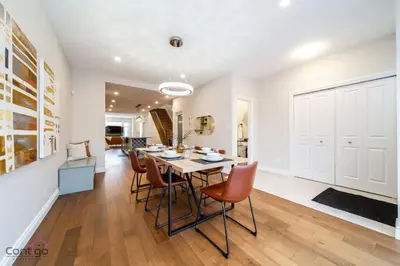 a kitchen and dining room with a table and chairs at The Azure, Near DT & University, TWO King Beds! in Edmonton