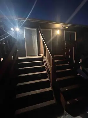 a set of stairs in a building with lights at Cute Highlandpark (Lower A Unit) in Calgary