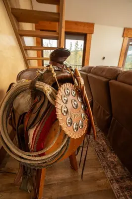 a purse sitting on a table next to a couch at River Safari Lodge in Blue River