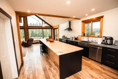 a kitchen with a large island in a room at River Safari Lodge in Blue River