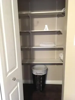 a cupboard with a trash can in a closet at Whitehorse Wonder in Whitehorse