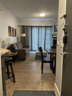 a living room with a couch and a table at Family friendly 2BR/2BA condo - Views & Location!! in Canmore