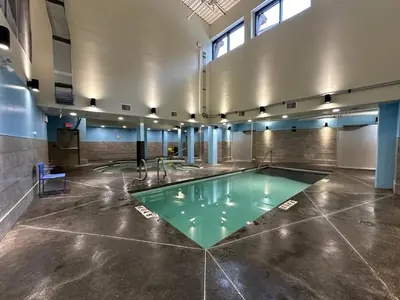 a pool in the middle of a room at Solara Studio with Pool/Hot tub/Parking/Gym in Canmore