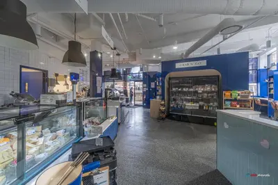 a store aisle of a grocery store with a counter sidx sidx sidx at Solara Studio with Pool/Hot tub/Parking/Gym in Canmore