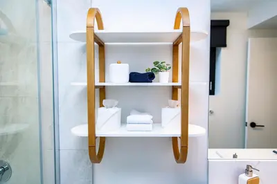 a shelf in a bathroom with toiletries on it at Separate Reality Retreat by Revelstoke Vacations in Revelstoke