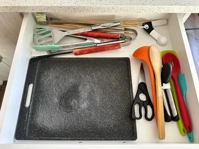 a drawer filled with pens scissors and other office supplies at B211 MTN View ground floor town house- 2BD, Sleeps 8, hot tub, free parking, close to Banff in Canmore