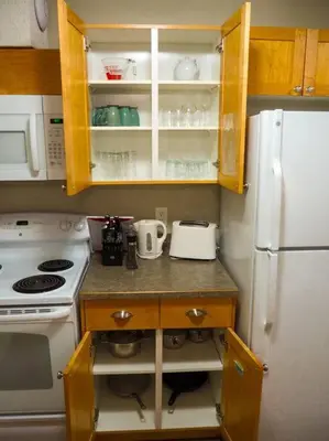 a kitchen with a stove and a white refrigerator at Cozy apartment in the heart of Panorama in Panorama