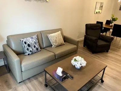 a living room with a couch and a coffee table at Luxury unit in the heart of Canmore in Canmore