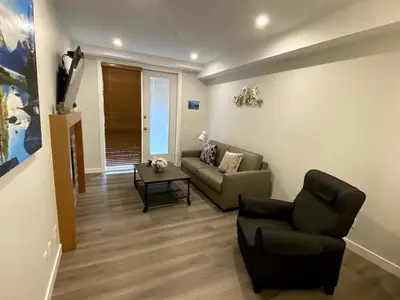 a living room with a couch and a table at Luxury unit in the heart of Canmore in Canmore