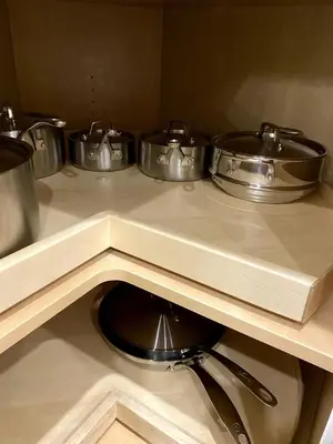 three pots and pans on a counter in a kitchen at Luxury unit in the heart of Canmore in Canmore