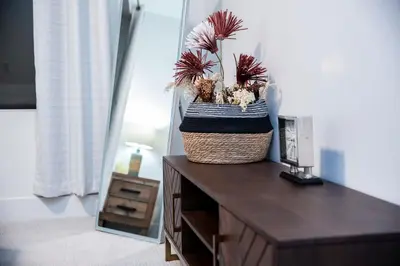 a basket of plants sitting on top of a dresser at Revelstoke Marvel - Two Bedroom with Hot Tub in Revelstoke