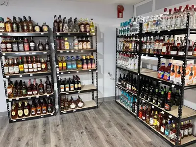 a room filled with lots of bottles of alcohol at The 22 Hotel in Cremona