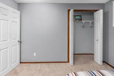 a bedroom with a closet and a door at Cozy 2-Bedroom Basement Suite Retreat Calgary in Calgary