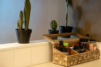 a wooden box sitting on a counter with potted plants at Mountain View 3br Loft Walk To Dt king fireplace in Canmore
