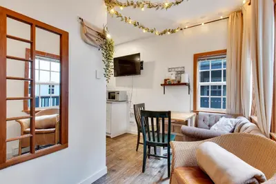 a living room with a couch and a table at Grey Whale, Pet Friendly Studio at The Beach in Ucluelet