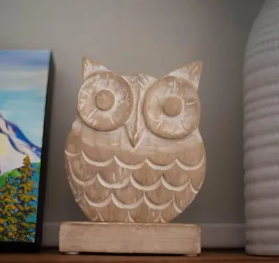 an owl statue sitting on top of a table at Moguls, Lofted Ski in Ski Out with Hot Tub Access in Panorama