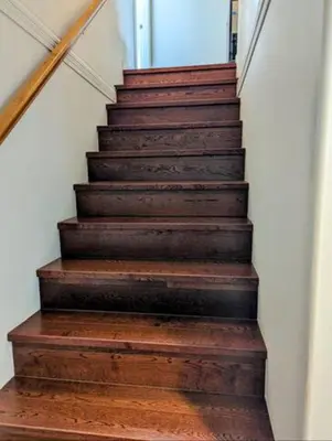 a staircase with wooden treads and a wooden floor at Ocean Park Loft in Surrey
