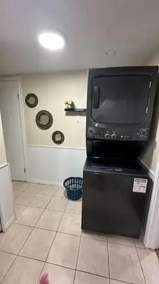 a television sitting on top of a black stand at Sabrina's Home in Delta