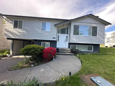 a house with a white door and a driveway at Sabrina's Home in Delta