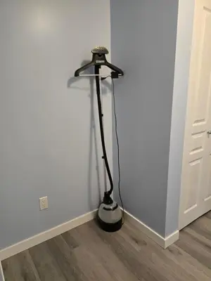 a black floor lamp in the corner of a room at Private basement suite in Langley