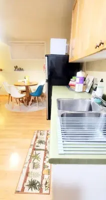 a kitchen with a sink and a kitchen with a table at EVCharger, Free Parking, Ski, Golf, BBQ, Awesomeness in Invermere