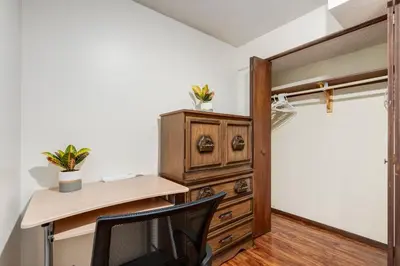 a home office with a desk and a chair at Simplistic 2BR Suite near Nose Hill & Airport in Calgary