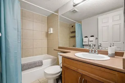 a bathroom with a sink and a toilet and a shower at Lakeside Memories, Pool, Hot Tub, Central in Invermere